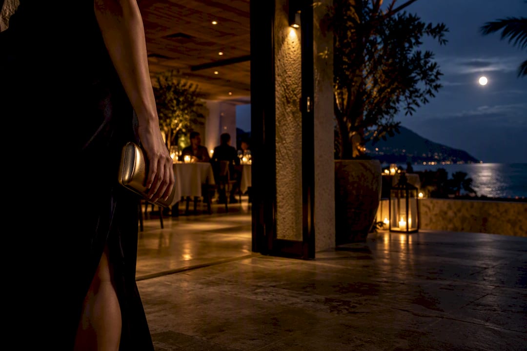 Woman arriving at an elegant resort restaurant