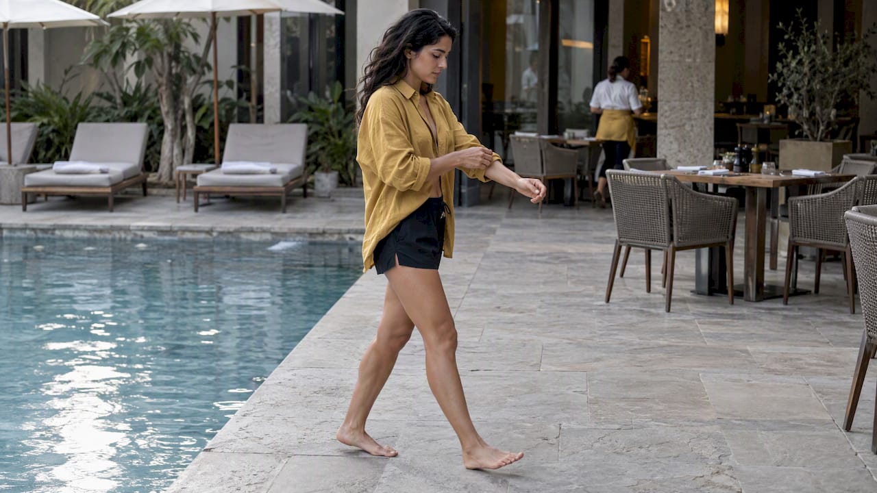 Woman styling swim shorts with a shirt